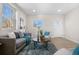 A bright living room featuring comfortable seating, ample light and neutral wall colors at 3073 S Elati St, Englewood, CO 80110
