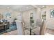 Open-concept living area featuring modern decor, ample natural light and inviting seating at 3073 S Elati St, Englewood, CO 80110
