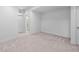 Spacious basement with neutral carpet ready to be customized into living or entertainment space at 6052 N Malta St, Aurora, CO 80019