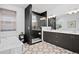 Modern bathroom featuring double vanity, freestanding tub, and tiled walk-in shower at 6052 N Malta St, Aurora, CO 80019
