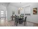 Dining room features large windows and an open floorplan to the rest of the home at 6052 N Malta St, Aurora, CO 80019