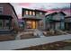 Contemporary home with a yellow door, landscaped front yard and front porch in a colorful neighborhood at 6052 N Malta St, Aurora, CO 80019