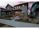 Stylish gray home with a inviting front porch and landscaped yard, nestled in a vibrant neighborhood at 6052 N Malta St, Aurora, CO 80019