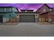 Spacious two-car garage with stone accents and well-maintained driveway at 6052 N Malta St, Aurora, CO 80019