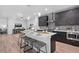 Modern kitchen featuring a large island, sleek cabinetry, and stainless steel appliances at 6052 N Malta St, Aurora, CO 80019
