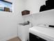 Convenient laundry room with modern washer and dryer, as well as storage space at 6052 N Malta St, Aurora, CO 80019