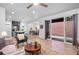 Bright open floor plan from the living room to dining room, kitchen, and the outdoor patio at 6052 N Malta St, Aurora, CO 80019