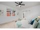Bright and airy primary bedroom with en-suite bathroom and modern ceiling fan at 6052 N Malta St, Aurora, CO 80019