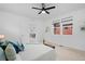 Bright and airy primary bedroom with en-suite bathroom and modern ceiling fan at 6052 N Malta St, Aurora, CO 80019