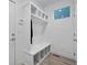 Functional mud room area with storage cubbies, bench, and bright natural light at 6052 N Malta St, Aurora, CO 80019