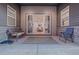 Covered patio featuring an outdoor rug, seating, and sliding glass doors leading to the living room at 6052 N Malta St, Aurora, CO 80019