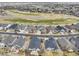 An aerial shot of a residential neighborhood near golf course and other green spaces at 15004 Verbena St, Thornton, CO 80602