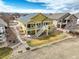 Two-story home showcasing a large deck, and landscaping for outdoor enjoyment at 15004 Verbena St, Thornton, CO 80602