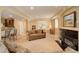 Open basement layout with a living area, wet bar, fireplace, neutral tones, and ample space at 15004 Verbena St, Thornton, CO 80602