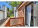 Open air balcony with wooden railing and a view of the backyard at 6330 E Wesley Ave, Denver, CO 80222