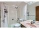 Neat bathroom with a shower-tub combo, mirrored vanity, and efficient use of space at 6330 E Wesley Ave, Denver, CO 80222