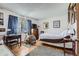 Cozy bedroom with hardwood floors, natural light, and ample space for relaxation and comfort at 6330 E Wesley Ave, Denver, CO 80222