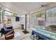 Enclosed sunroom offers abundant natural light, perfect for relaxation and enjoying the outdoors at 6330 E Wesley Ave, Denver, CO 80222
