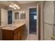 Bathroom featuring a shower, vanity with sink, and open doorway to a bedroom at 1060 S Parker Rd # 9, Denver, CO 80231