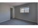 A simple bedroom offers comfortable carpet, a sliding closet door, and a window at 1060 S Parker Rd # 9, Denver, CO 80231