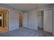 Bedroom featuring plush gray carpeting, ensuite bath, and a closet with sliding doors at 1060 S Parker Rd # 9, Denver, CO 80231