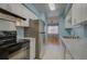Efficient kitchen design with black appliances, white cabinetry, and durable countertops at 1060 S Parker Rd # 9, Denver, CO 80231