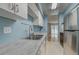 Functional kitchen with stainless steel appliances, white cabinets, and durable countertops at 1060 S Parker Rd # 9, Denver, CO 80231