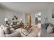 Inviting living room featuring a stylish gray sofa set, wooden coffee table, and bright, neutral tones at 1060 S Parker Rd # 9, Denver, CO 80231