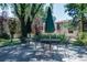 A quiet patio features green shade umbrellas and outdoor seating at the condo complex at 1060 S Parker Rd # 9, Denver, CO 80231