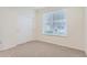 Cozy bedroom with a window with blinds and a built-in closet with sliding doors at 9907 Martin Luther King Blvd # 103, Denver, CO 80238