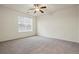 Bedroom with ceiling fan, neutral tones, and bright natural light at 9907 Martin Luther King Blvd # 103, Denver, CO 80238