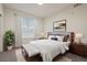 Cozy bedroom with generous window, neutral colors, and stylish decor at 9907 Martin Luther King Blvd # 103, Denver, CO 80238