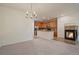 Dining area with view into the kitchen and a cozy fireplace at 9907 Martin Luther King Blvd # 103, Denver, CO 80238