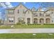 Attractive multi-story home featuring stone accents, balconies, and well-maintained landscaping at 9907 Martin Luther King Blvd # 103, Denver, CO 80238