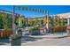 Bustling shopping center with outdoor seating and dining options for a vibrant community experience at 9907 Martin Luther King Blvd # 103, Denver, CO 80238