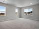 Neutral bedroom featuring carpet, recessed lighting, and several windows at 17831 Parkside N Dr, Commerce City, CO 80022