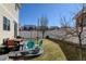 A backyard area with patio space featuring outdoor seating and a grill on a sunny day at 21088 Randolph Pl, Denver, CO 80249