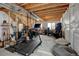 Unfinished basement featuring exposed utilities and framing, exercise equipment and neutral painted walls at 21088 Randolph Pl, Denver, CO 80249