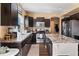 Modern kitchen with stainless steel appliances, spacious countertops, and ample cabinet space at 21088 Randolph Pl, Denver, CO 80249