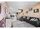 Bright living room with a gray sofa, a modern rug, and stylish decor at 21088 Randolph Pl, Denver, CO 80249