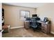 Home office with desk, office chair and natural light at 21088 Randolph Pl, Denver, CO 80249