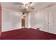 Bedroom with a ceiling fan, large window, and a doorway leading to another room at 1000 Salem St, Aurora, CO 80011