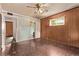 Bedroom with ceiling fan, a window, and a door leading to an en suite bathroom at 1000 Salem St, Aurora, CO 80011