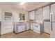 A well-appointed kitchen featuring classic appliances and practical layout for cooking at 1000 Salem St, Aurora, CO 80011