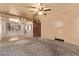 Cozy living room with carpet flooring, retro ceiling, and a ceiling fan at 1000 Salem St, Aurora, CO 80011