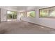 Spacious living room with large windows and sliding glass door offering natural light at 1000 Salem St, Aurora, CO 80011