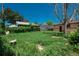 A cozy brick home with a backyard featuring an overgrown garden at 10839 Carrol Ln, Northglenn, CO 80233