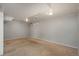 Spacious unfinished basement area with carpeted flooring and a small window for natural light at 10839 Carrol Ln, Northglenn, CO 80233
