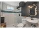 Modern bathroom with white subway tile, glass shower, and stylish vanity at 10839 Carrol Ln, Northglenn, CO 80233