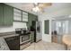 The kitchen features tile flooring, granite countertops, and stainless steel appliances at 10839 Carrol Ln, Northglenn, CO 80233